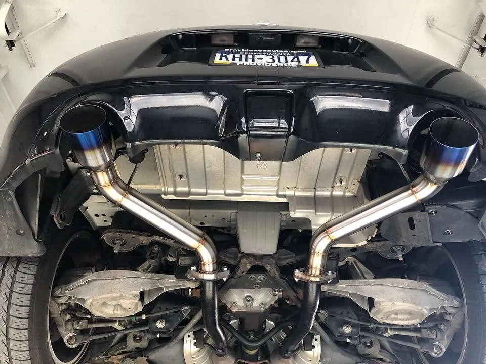 Custom mandrel-bent dual exhaust under a vehicle