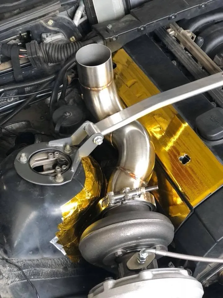 Turbocharger with fabricated downpipe